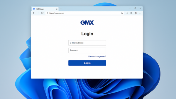 Windows 11 Desktop mit geöffnetem Browserfenster, das die GMX Login-Seite mit Eingabefeldern für E-Mail-Adresse und Passwort zeigt.